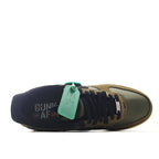Olive-brown sneaker with dark insole area, lace panel and mint green hang tag