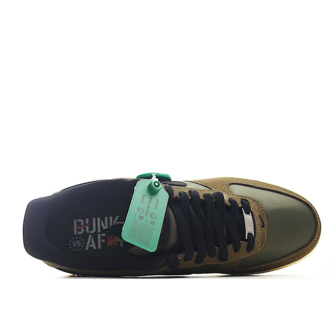 Olive-brown sneaker with dark insole area, lace panel and mint green hang tag