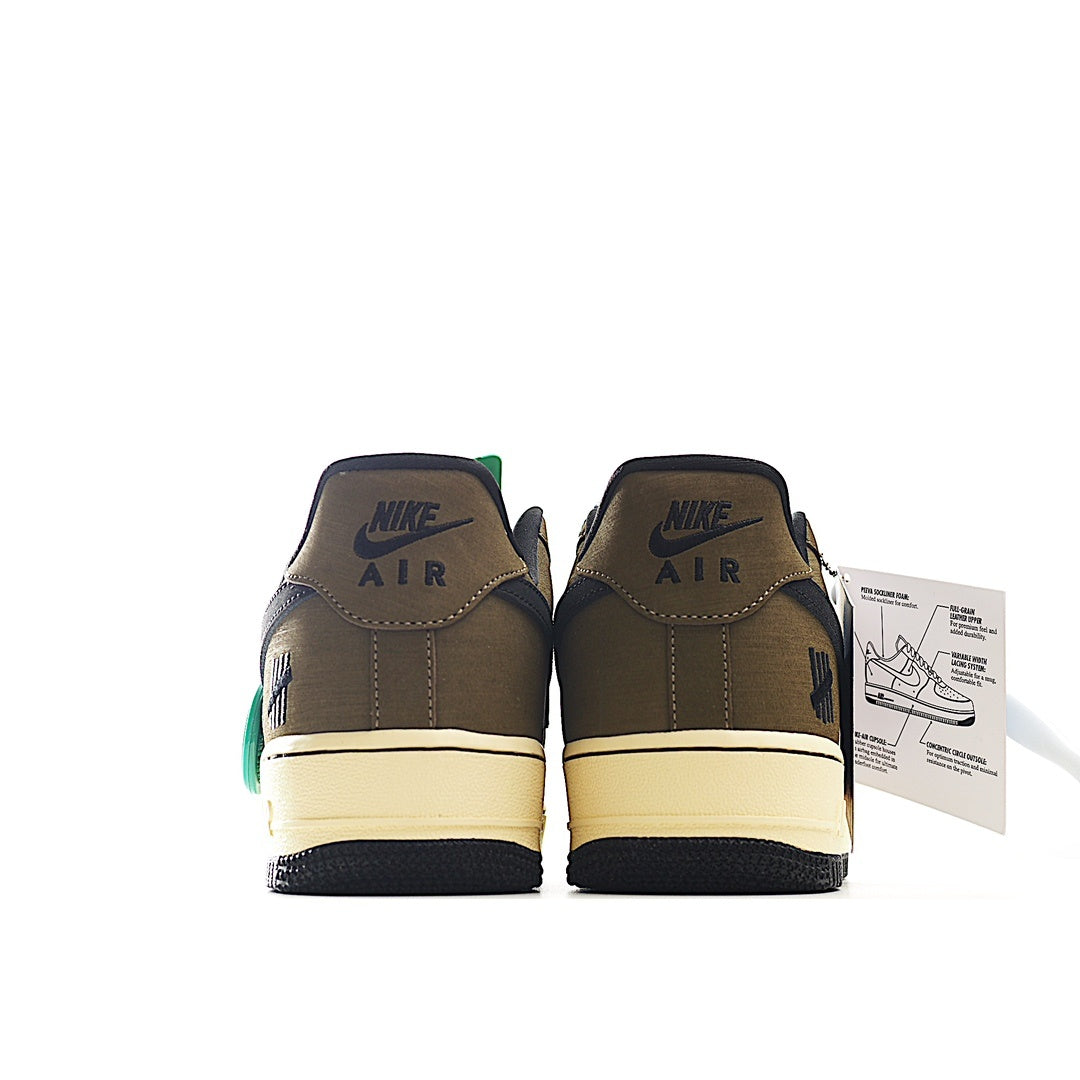 Brown low-top Nike Air Force 1 sneakers, cream sole, dark swoosh, lace-up