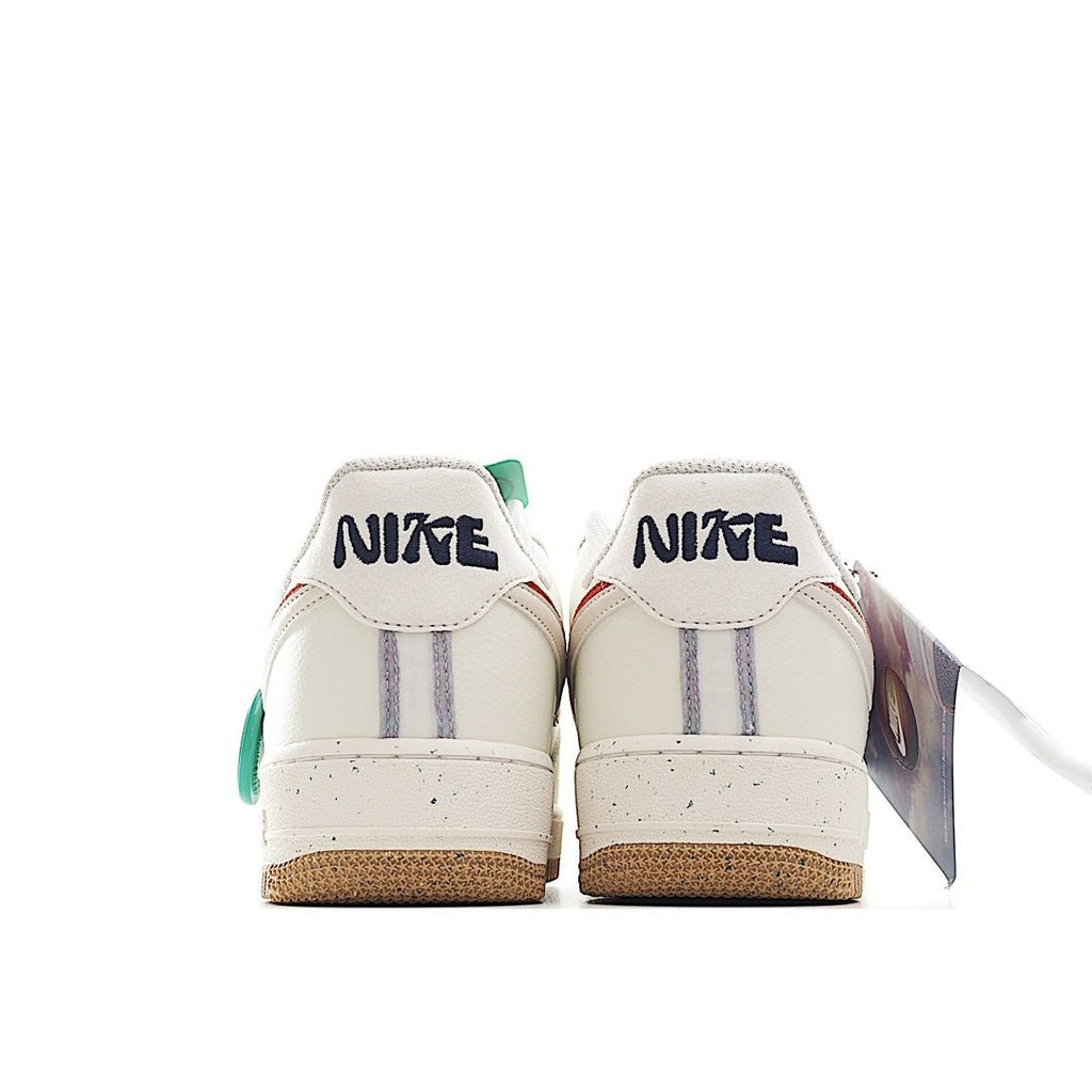 White Nike Air Force 1 sneaker heel view with green accents and gum sole
