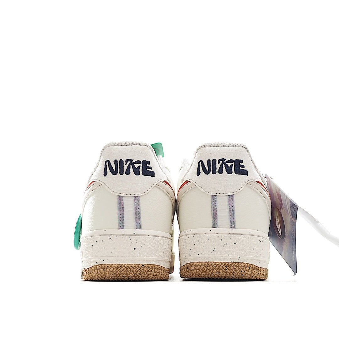 White Nike Air Force 1 sneaker heel view with green accents and gum sole