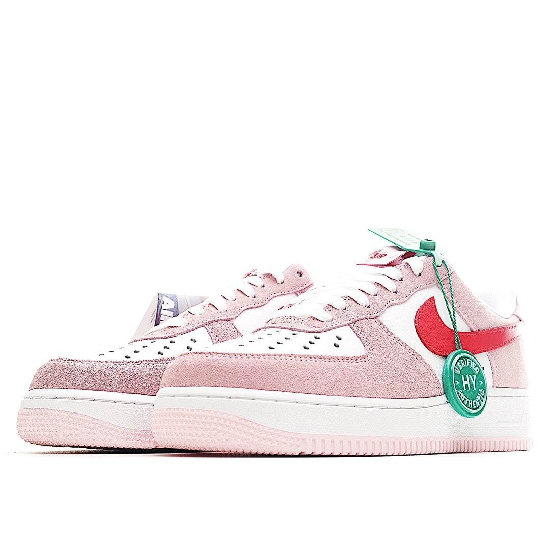 Nike Air Force 1 low-top sneakers, pink and white with red swoosh, lace-up view
