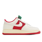 Low-top sneakers with white leather and red swoosh panel; mint tag on tongue