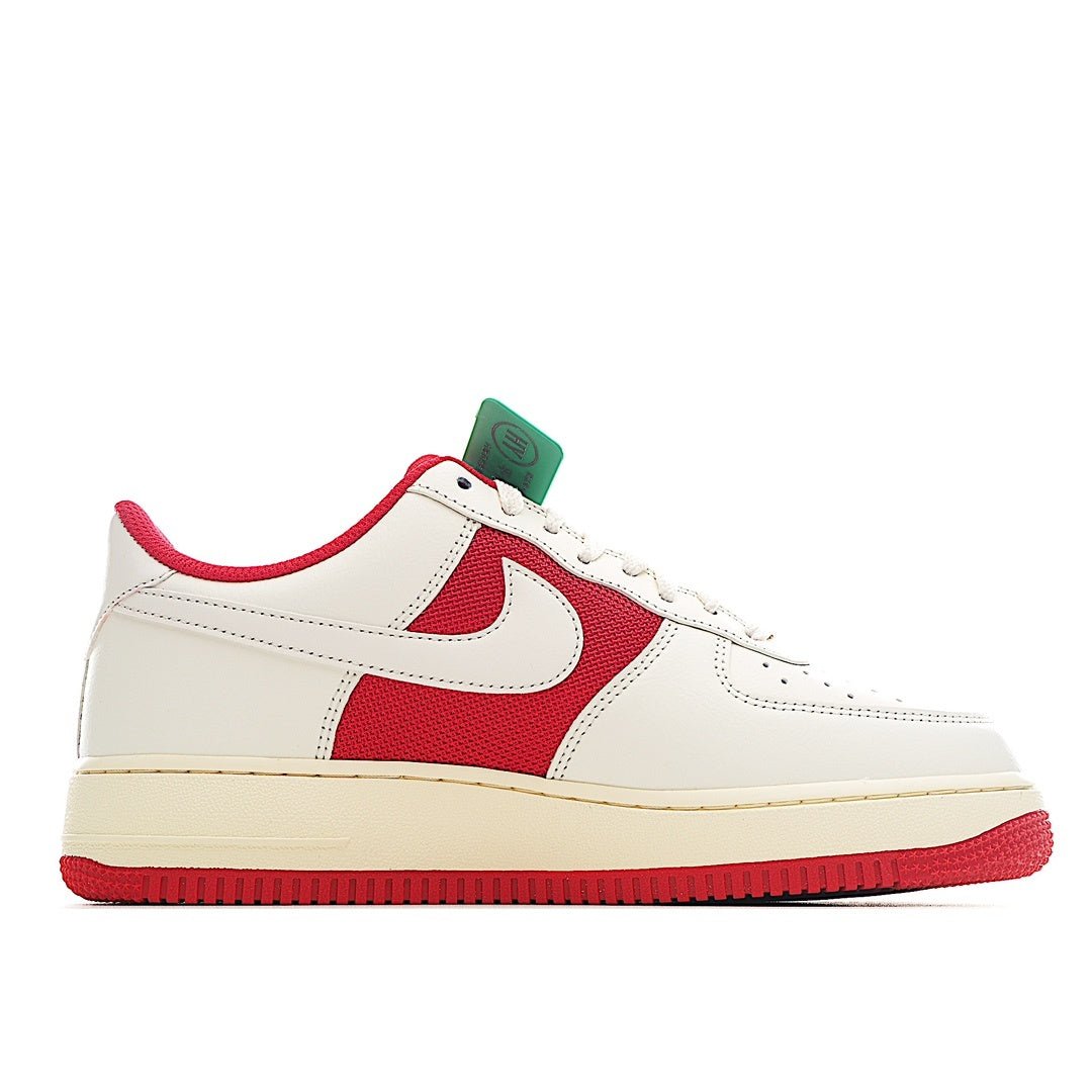 Low-top sneakers with white leather and red swoosh panel; mint tag on tongue