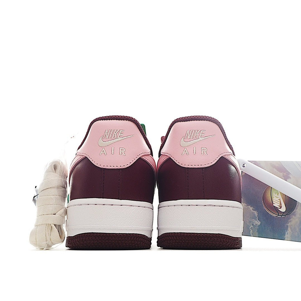 Nike Air Force 1 sneaker heel view in burgundy with white midsole and pink tongue lining