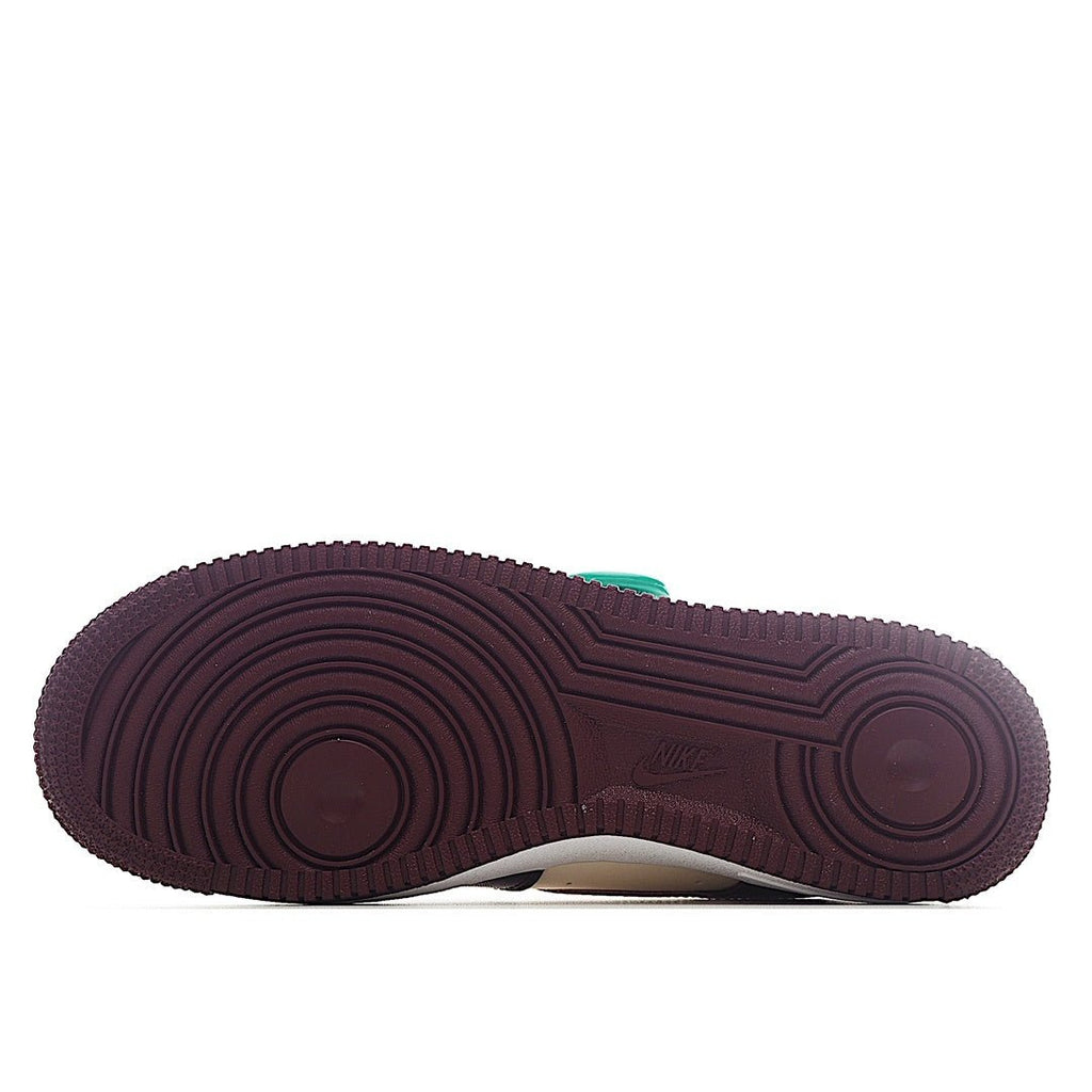 Nike Air Force 1 outsole with burgundy rubber tread and white midsole edge