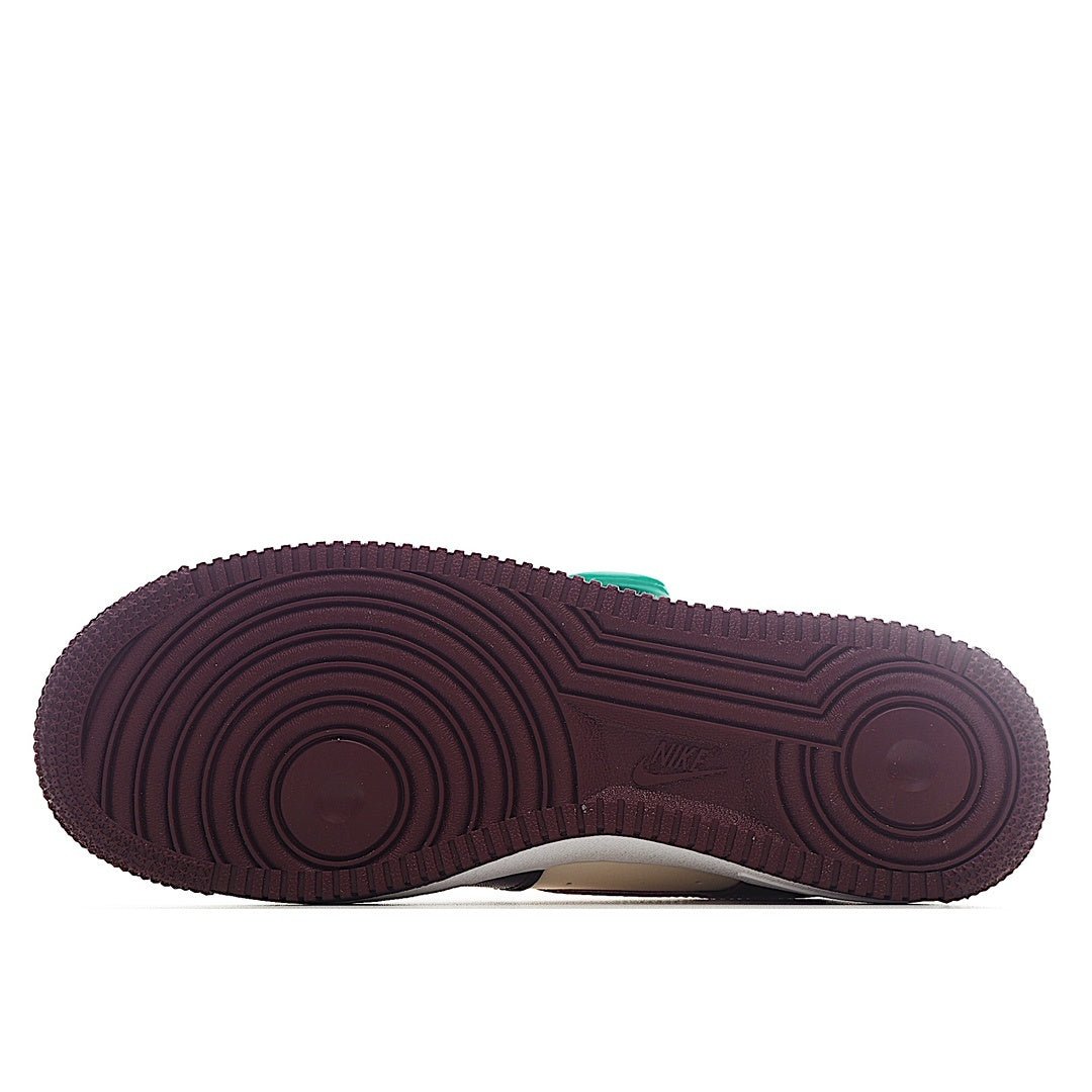 Nike Air Force 1 outsole with burgundy rubber tread and white midsole edge
