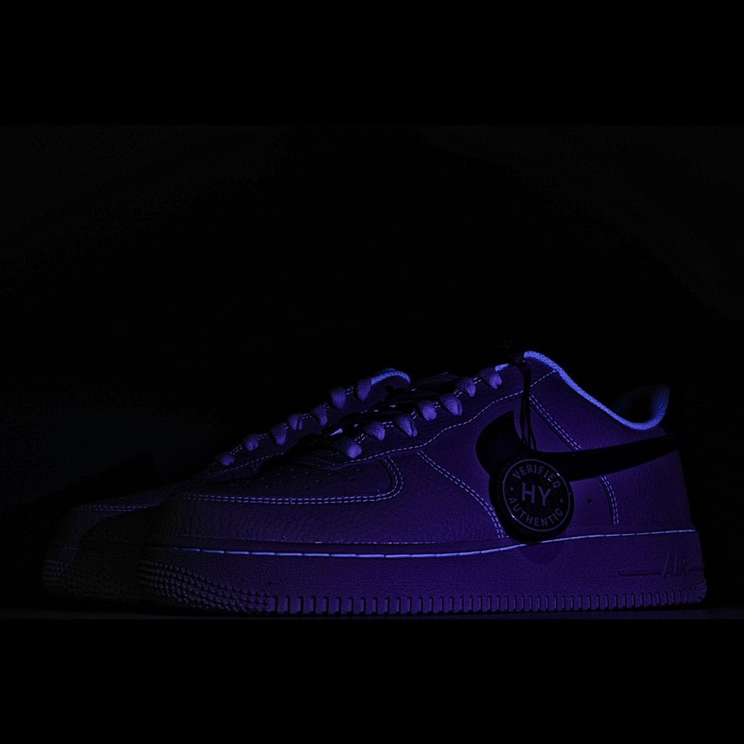 Nike Air Force 1 sneaker in dark purple with blue accents and HY tag at side