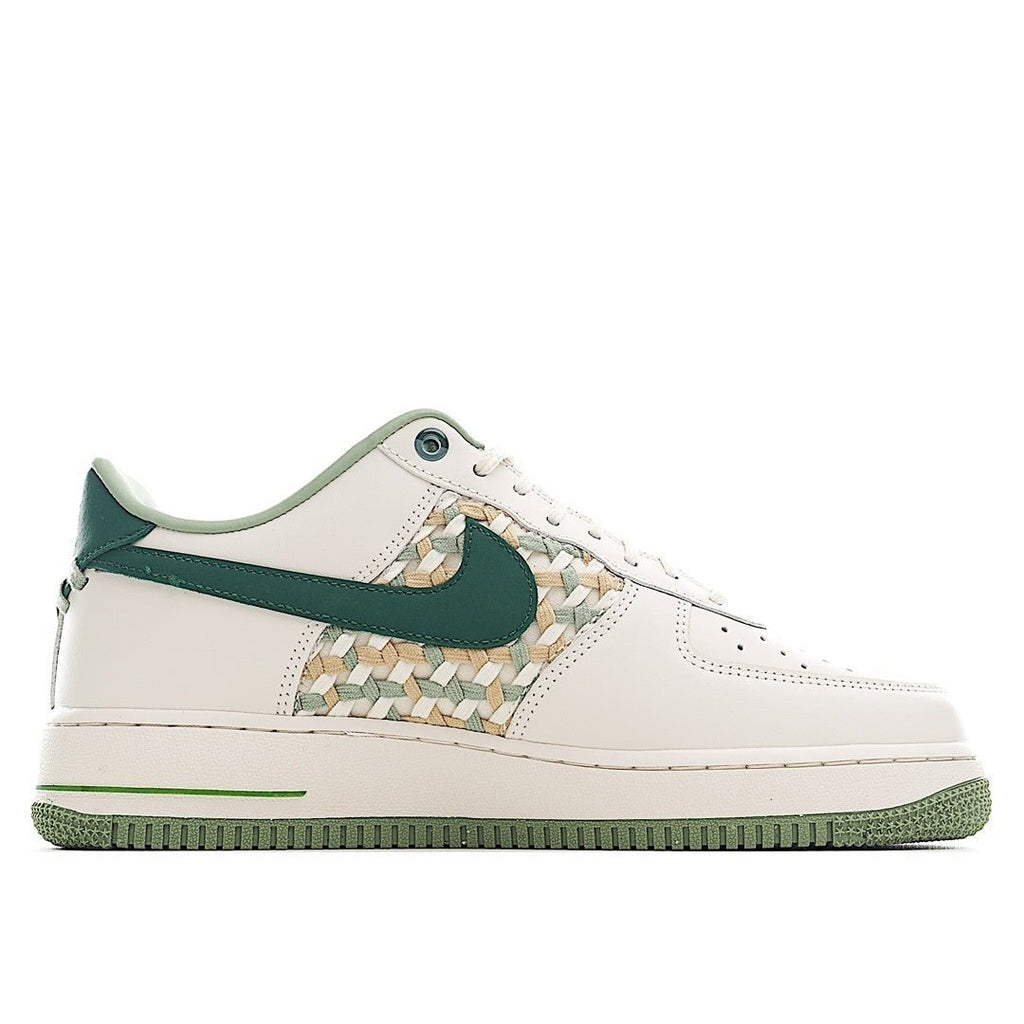 White and green low-top sneakers with teal swoosh and woven detail on side panel.