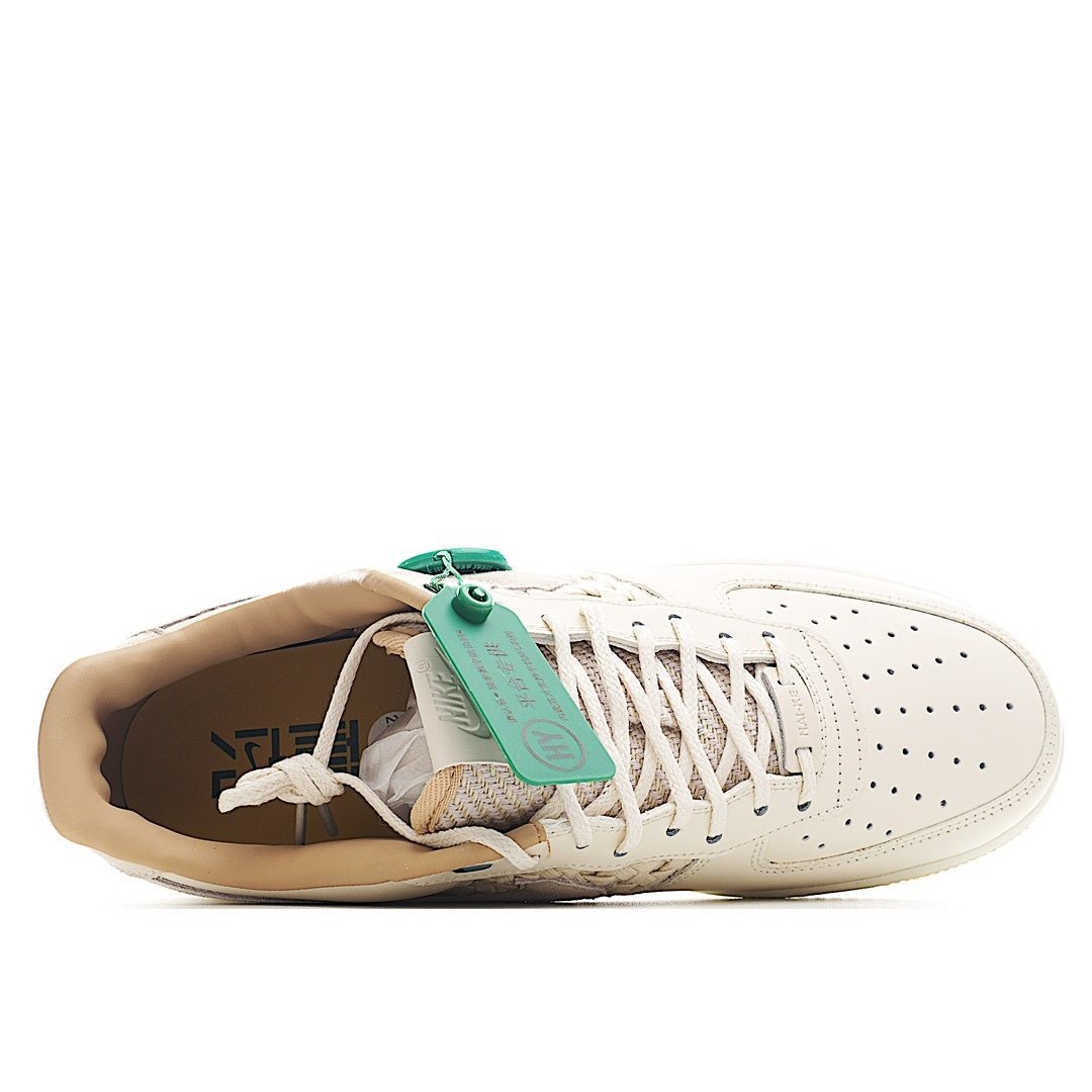 Nike Air Force 1 low-top sneaker, white upper with green hang tag and laced detail