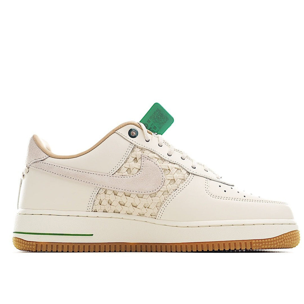 Nike Air Force 1 low-top sneaker, white leather with green logo stripe and tan outsole