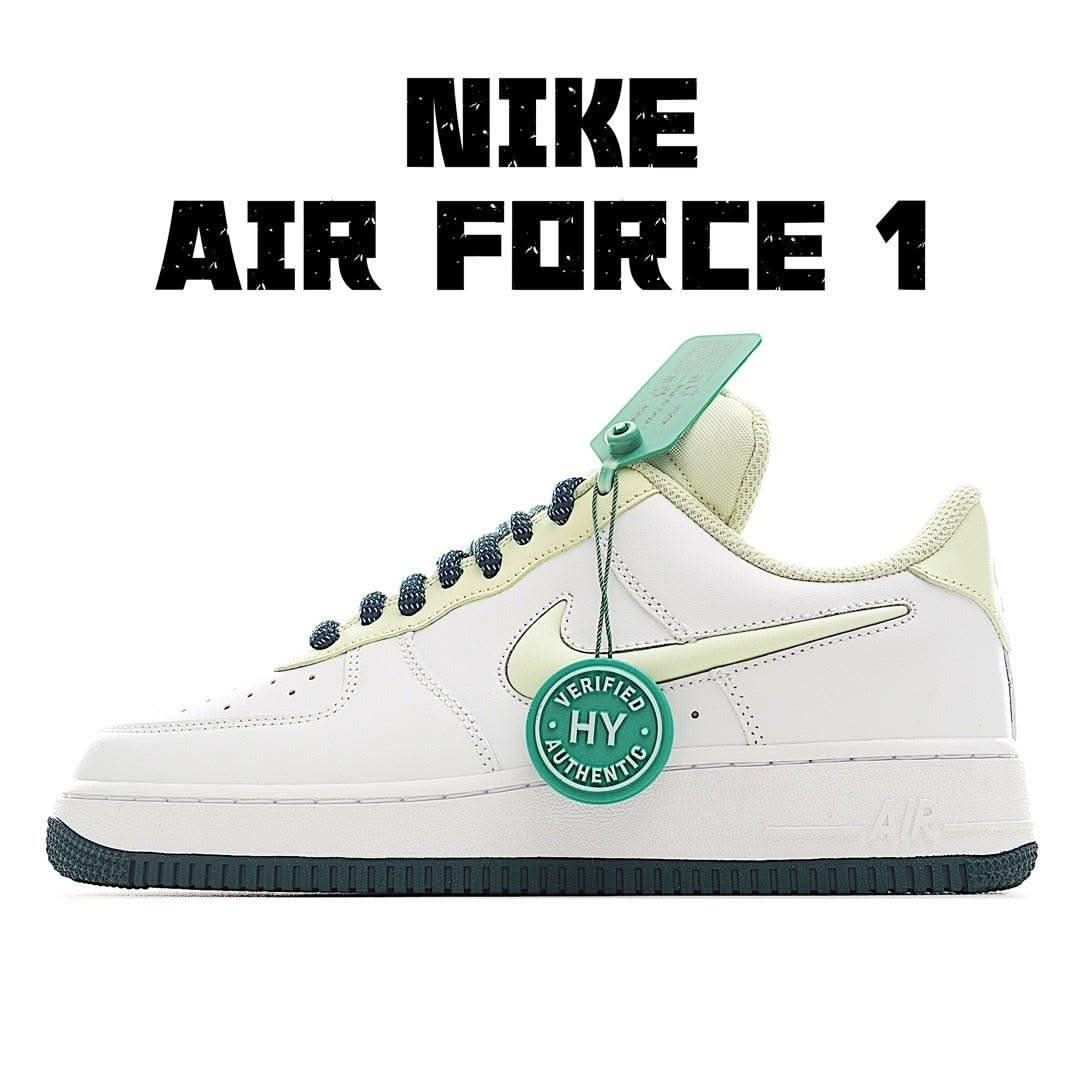 Nike Air Force 1 sneakers in white with light green accents, navy laces, mint tag