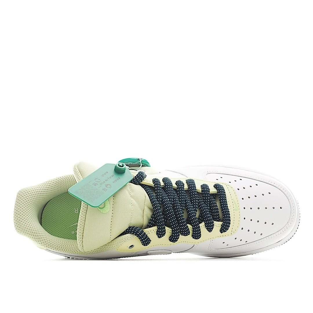Nike Air Force 1 sneakers, white with light green lining and mint tag, navy lace-up