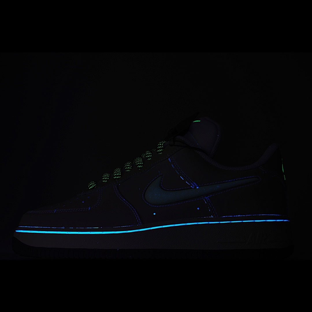 Dark navy Nike Air Force 1 sneakers with glowing blue stripe and neon green accents