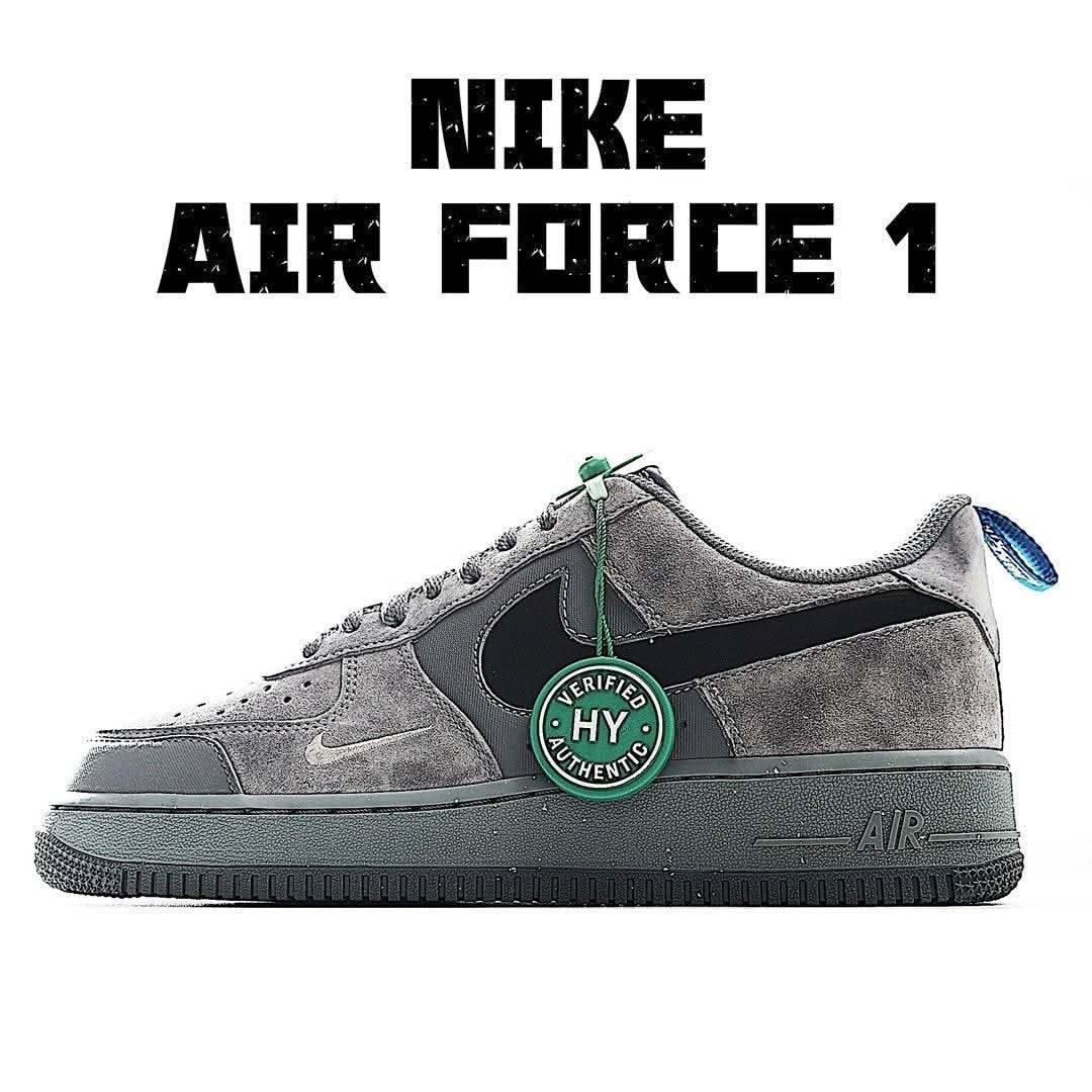 Gray Nike Air Force 1 low-top sneakers, black swoosh and green heel tag