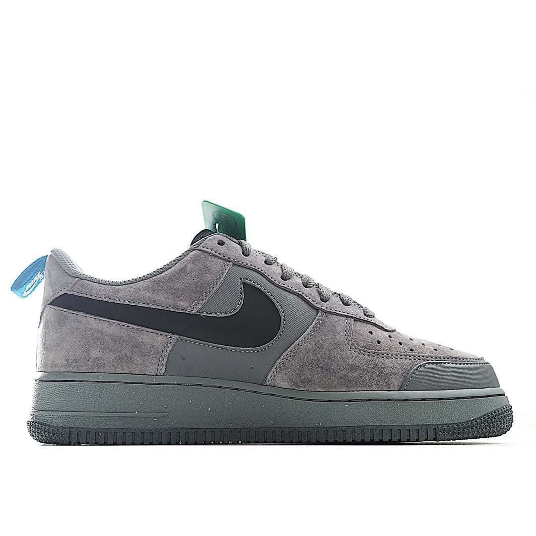 Gray Nike Air Force 1 low-top sneakers, black logo on quarter