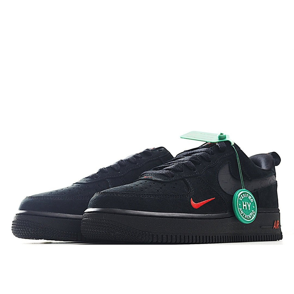 Black low-top sneaker side view with red swoosh, green tag, and Air detail