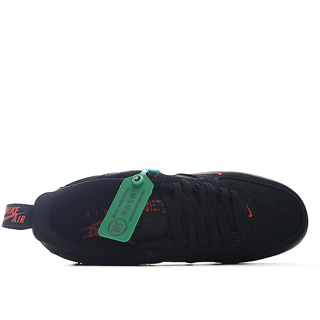 Black low-top sneaker interior view with green hang tag and red swoosh