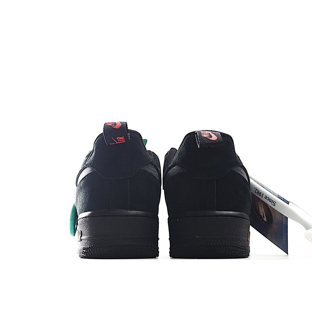 Black low-top sneaker heel view with red swoosh and teal accents