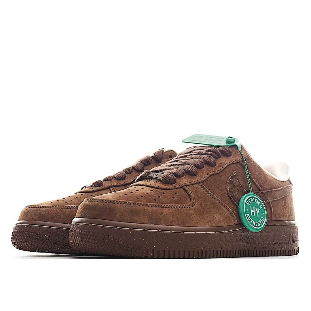 Brown suede Nike Air Force 1 low-top sneaker, side and heel view with green tag