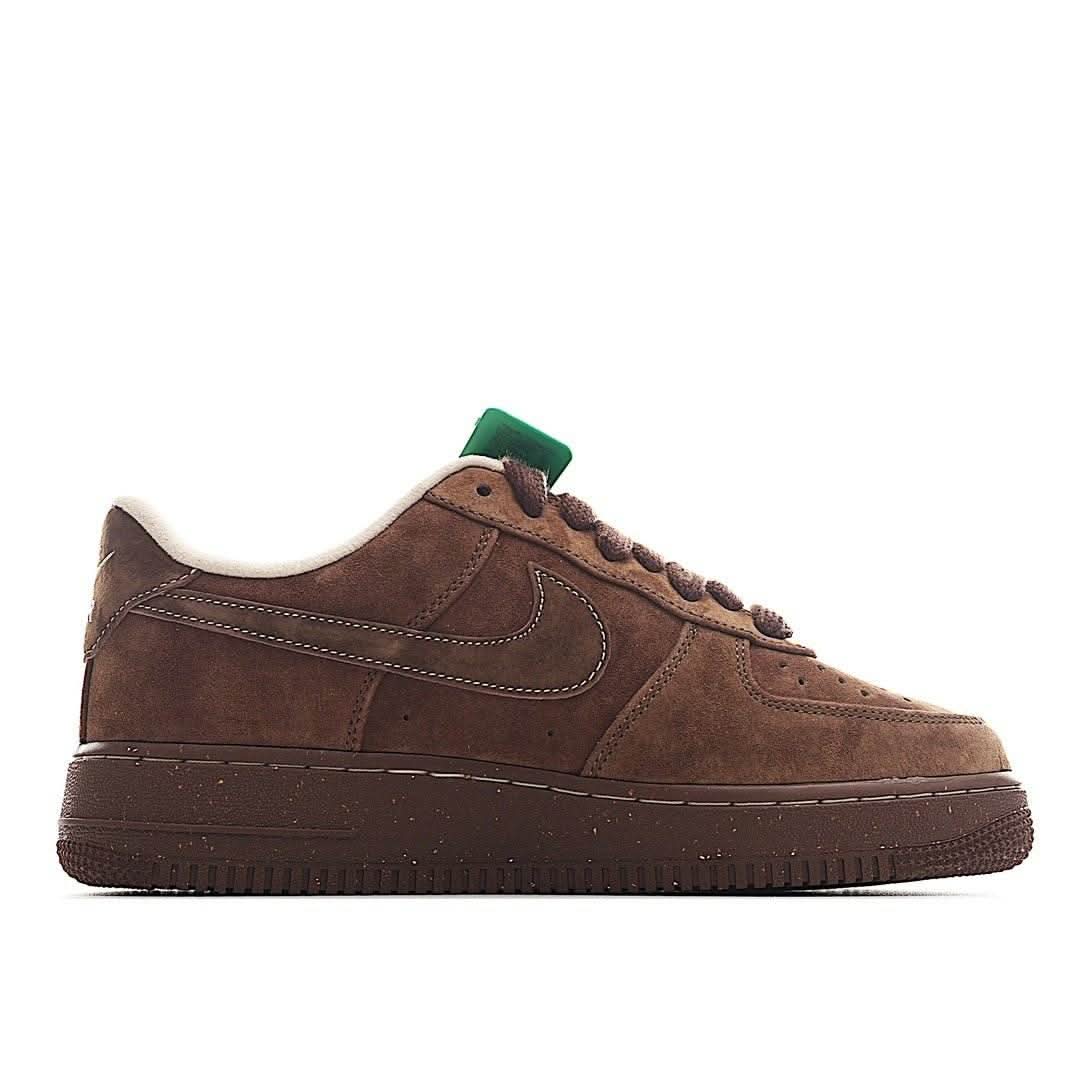 Brown suede Nike Air Force 1 low-top sneaker, front-side view with green lace tag