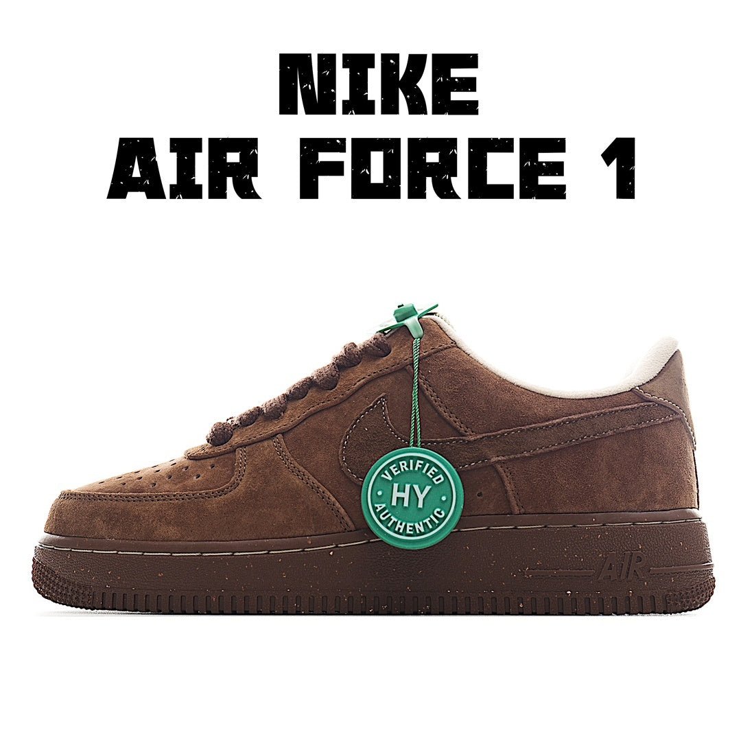 Brown suede low-top sneaker with white sole, lace-up, and green authenticity tag