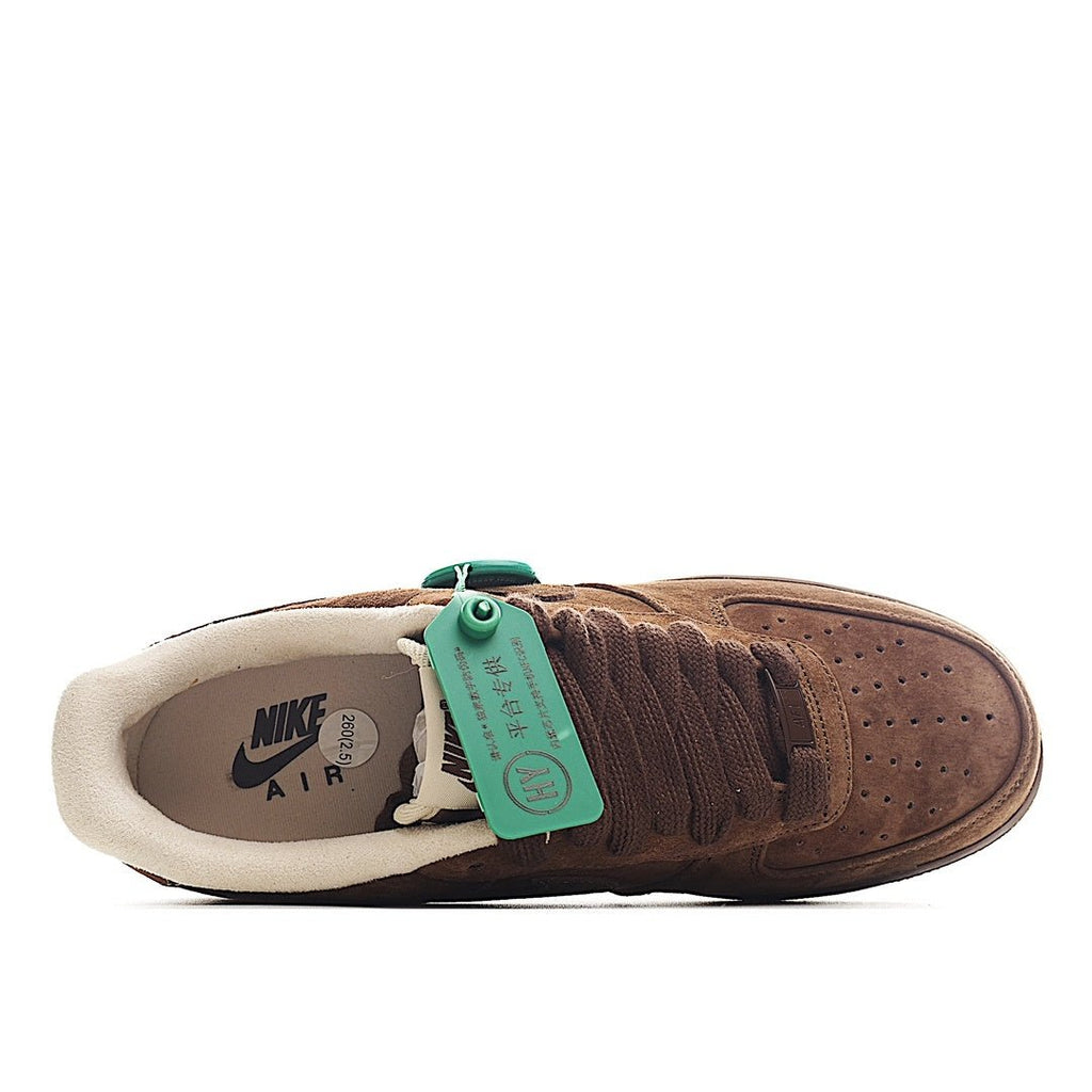 Brown suede sneaker heel and interior lining, green tag attached to the collar