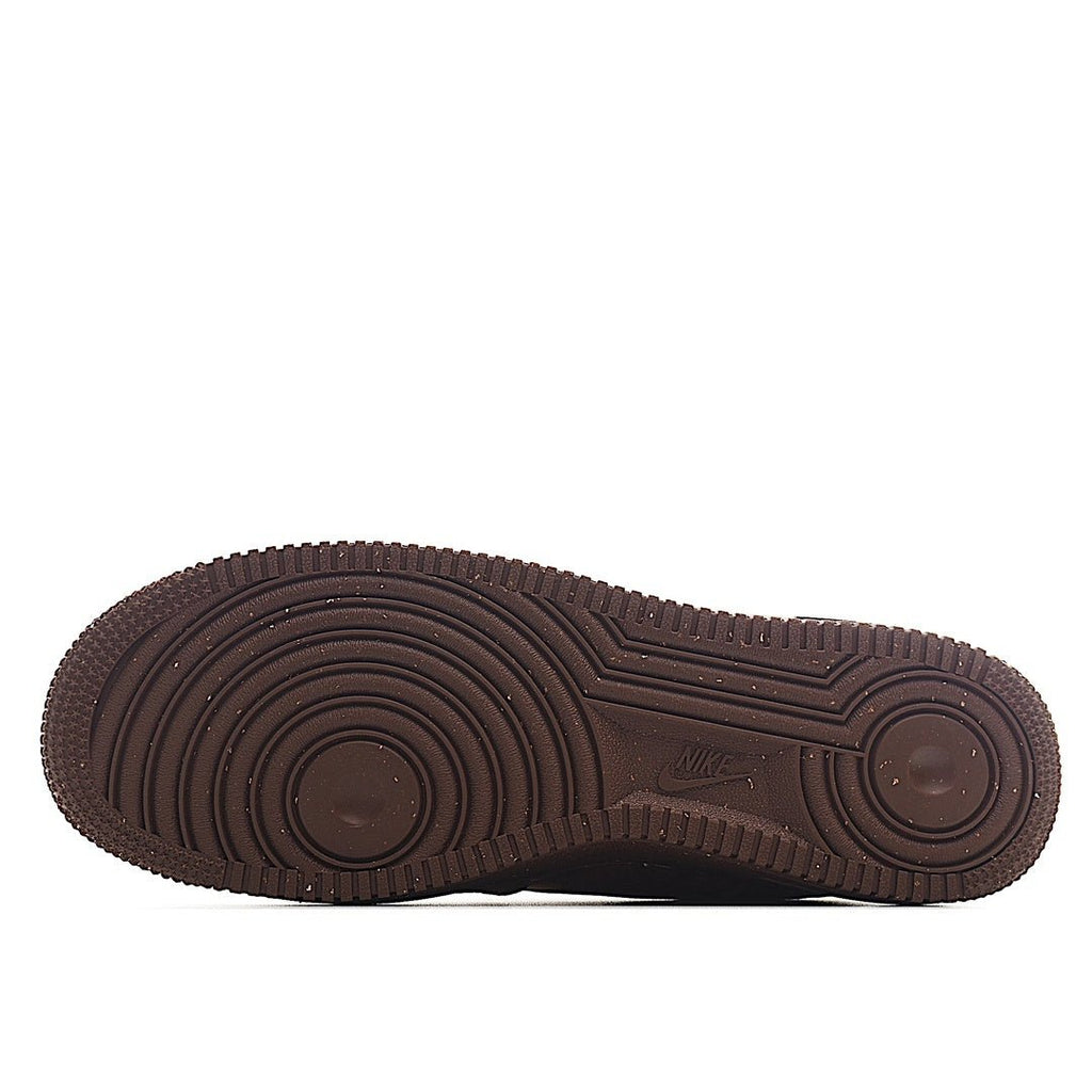 Brown rubber outsole with circular tread pattern for grip