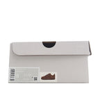 Shoe box with label showing brown low-top sneaker
