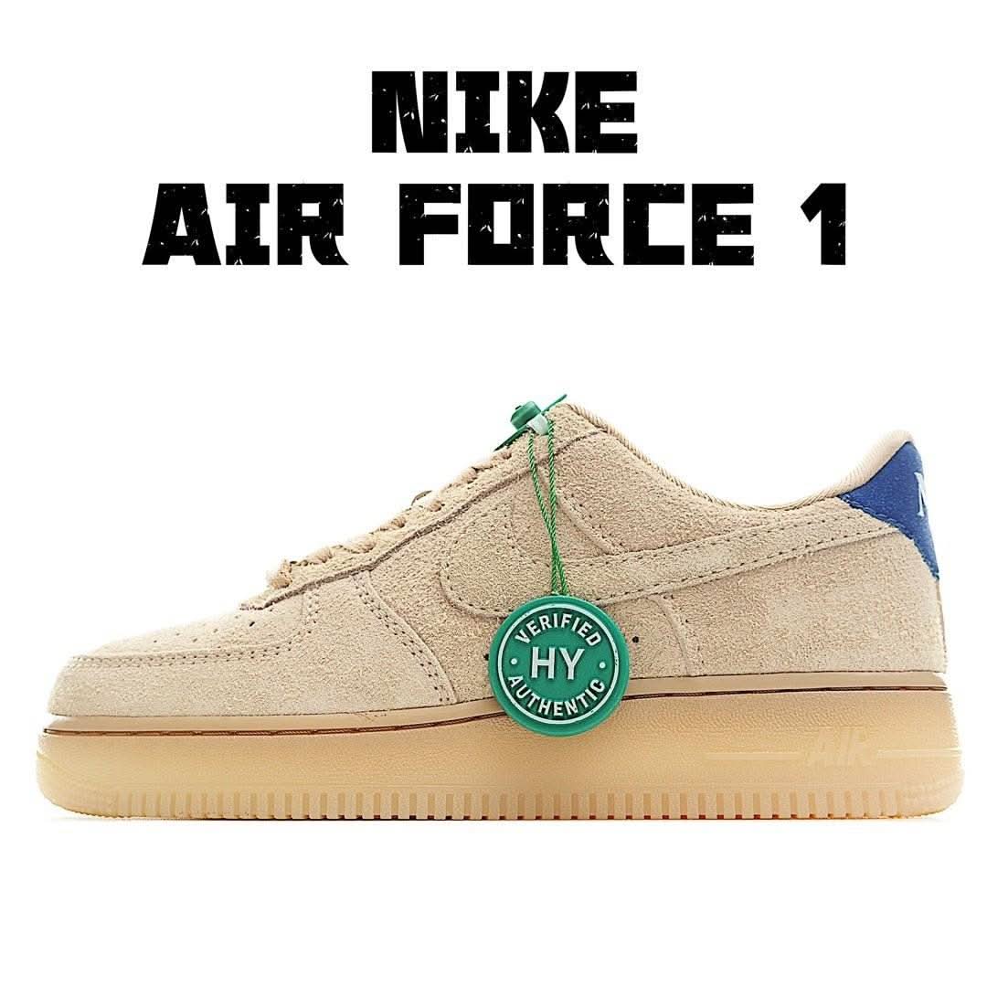 Beige suede low-top sneakers with blue side panel, gum rubber sole, green tag