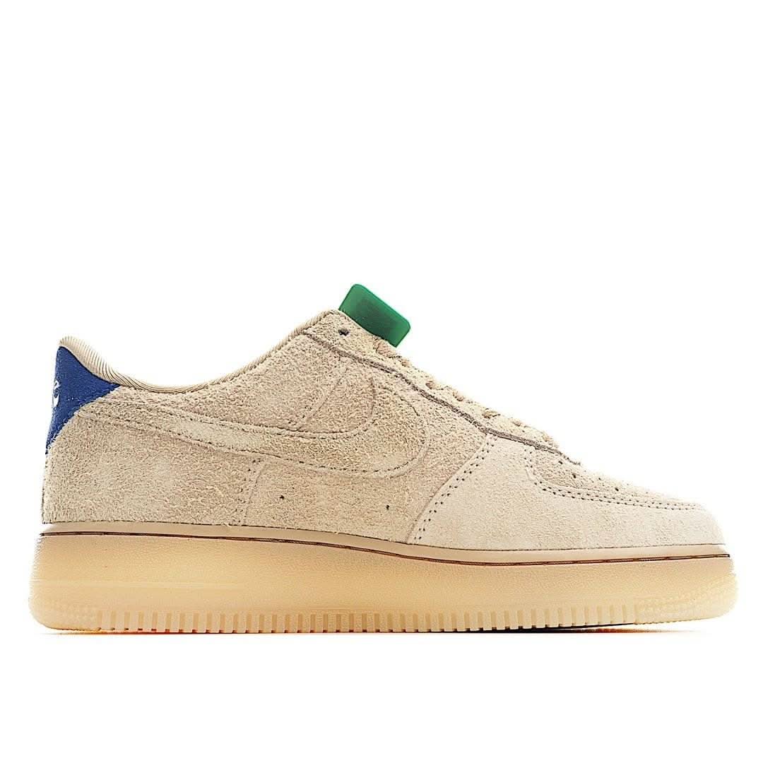 Beige suede low-top sneakers with blue heel accent, lace-up, gum rubber sole