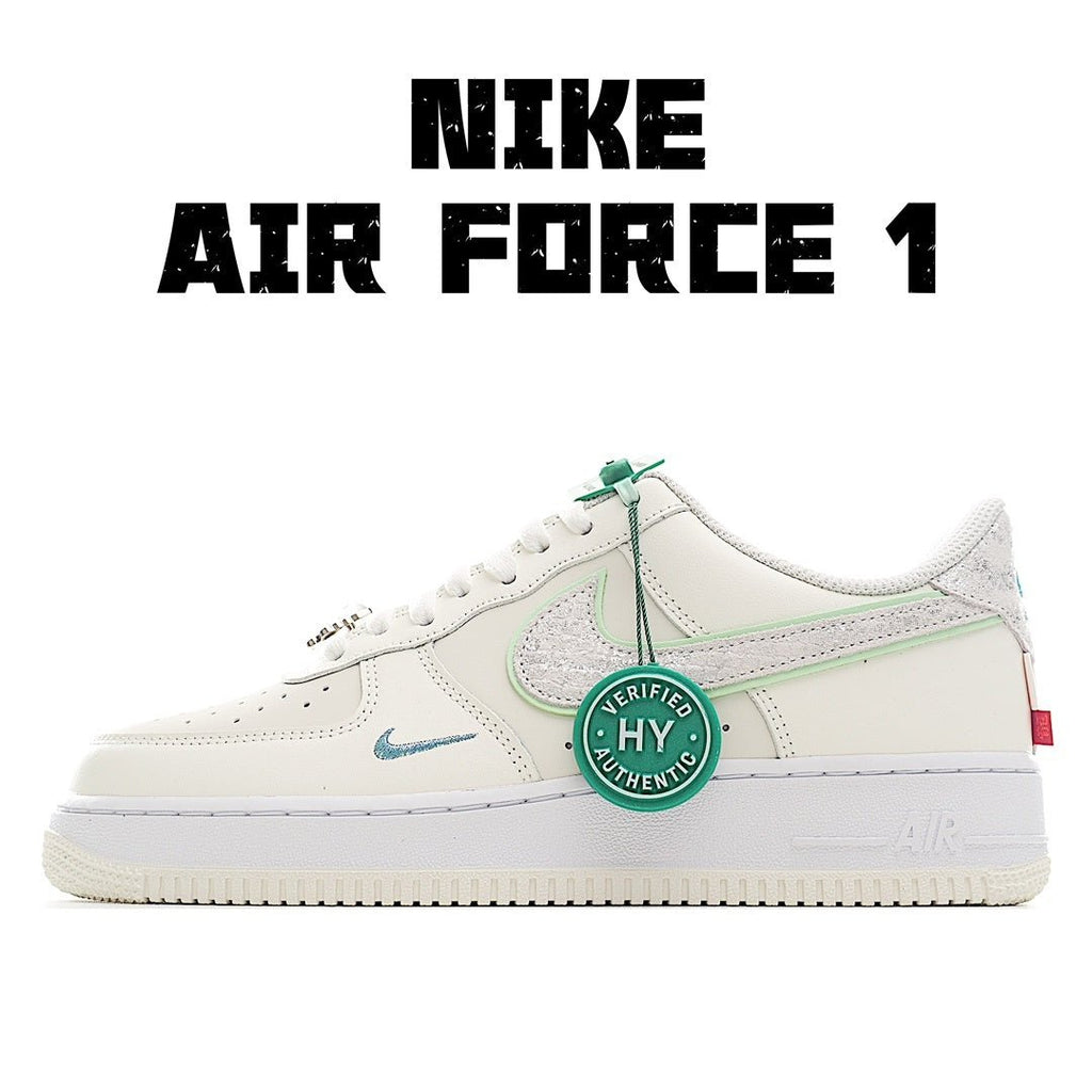 Nike Air Force 1 sneaker in white with mint green accents and lace tag