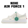 Nike Air Force 1 sneaker in white with mint green accents and lace tag