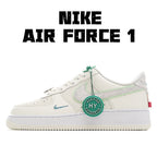 Nike Air Force 1 sneaker in white with mint green accents and lace tag