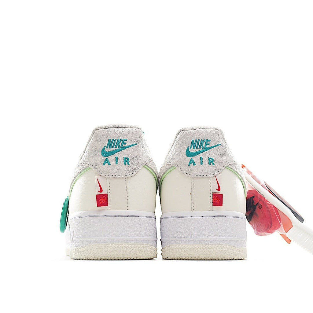 Nike Air Force 1 sneaker heel view, white leather with mint green branding