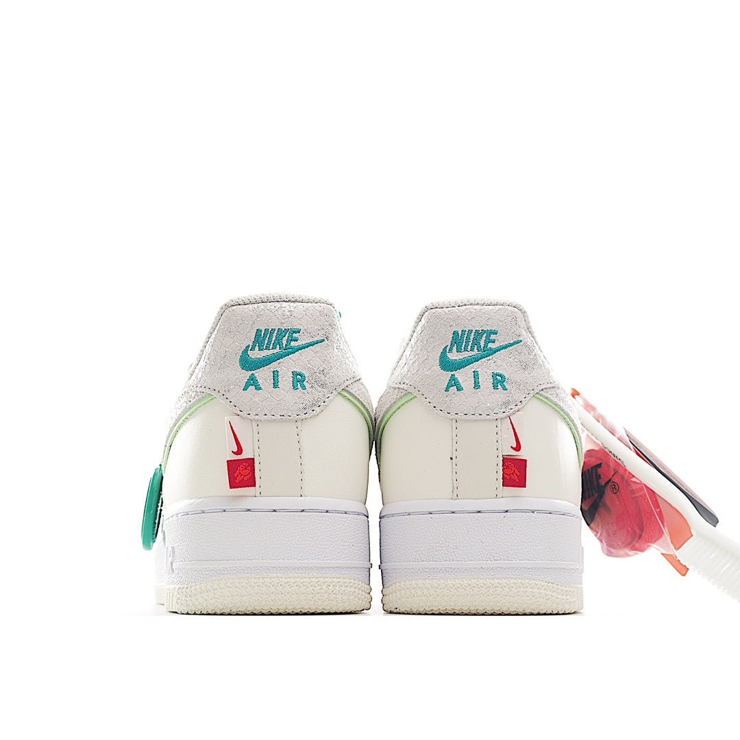 Nike Air Force 1 sneaker heel view, white leather with mint green branding
