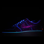Nike Air Force 1 sneaker, dark blue upper with purple glitter swoosh