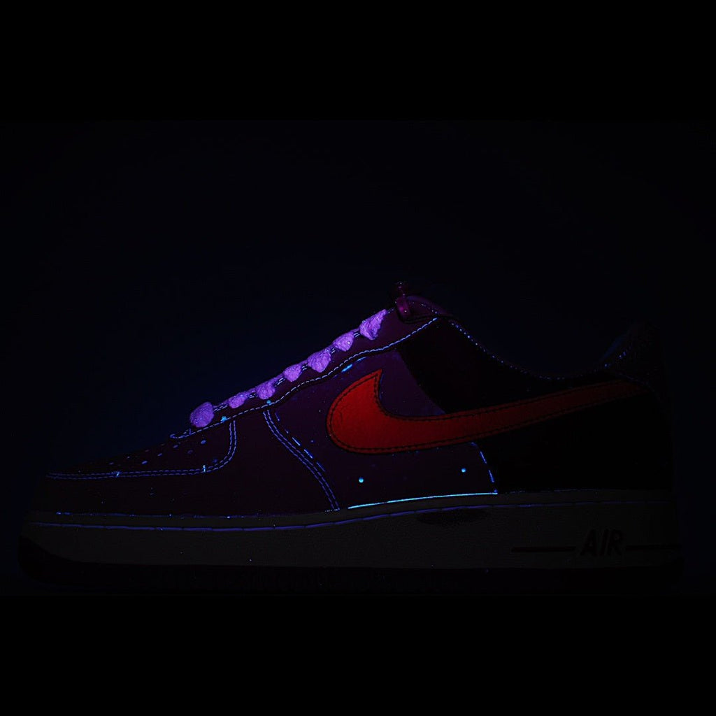 Nike Air Force 1 sneaker, dark upper with red swoosh accents