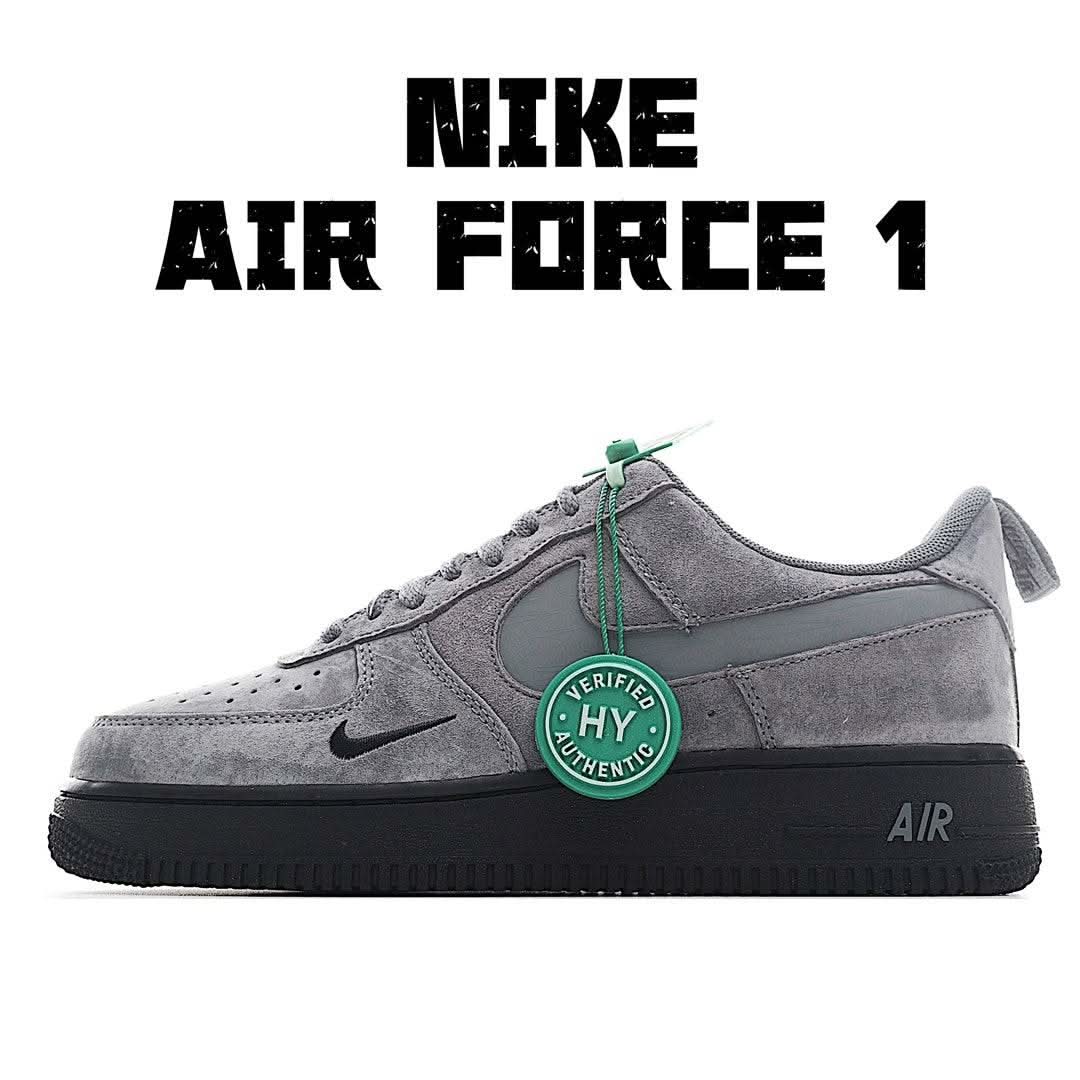Grey suede Air Force 1-style sneakers with green lace tag and black sole