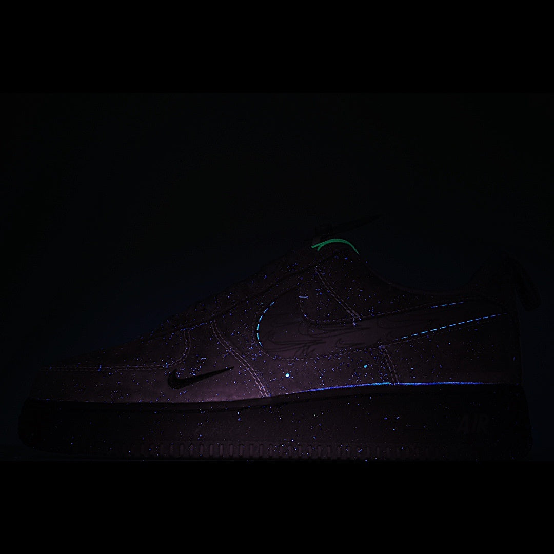Dark gray sneakers with subtle blue-purple stitching detail