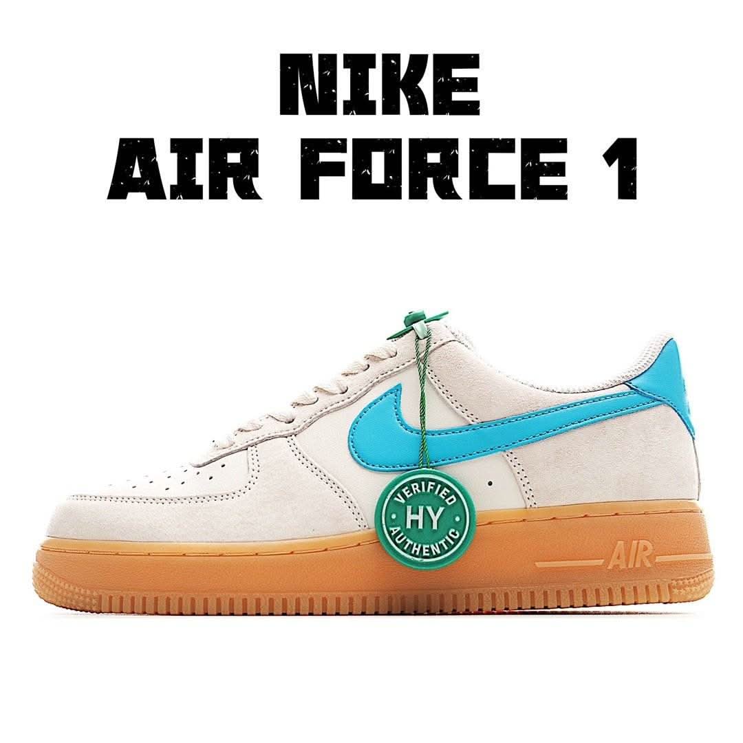 Cream & light-blue low-top sneaker with green accents and gum orange sole