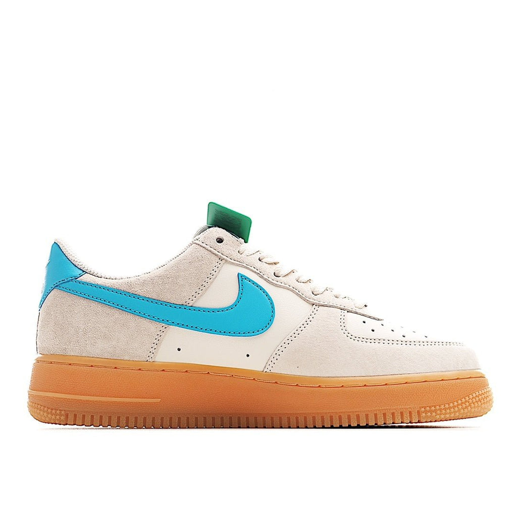 White Air Force 1 style sneaker with teal side swoosh and green heel tab