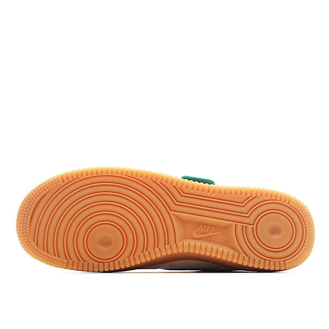 White sneaker outsole with teal accents and gum rubber tread