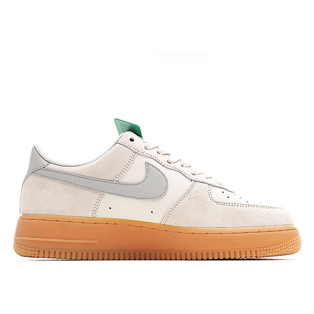 Low-top sneakers in off-white with gray swoosh and gum sole, teal lace accent