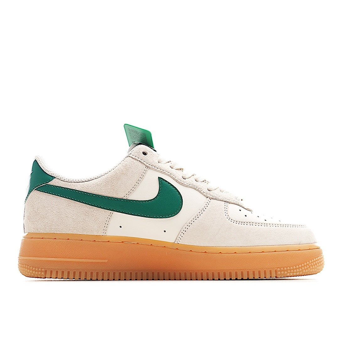 Nike Air Force 1 low-top sneakers, front quarter view: white upper with green swoosh and tan outsole