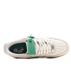 Nike Air Force 1 low-top sneakers, lace-up front: white upper with green heel tab and tan sole