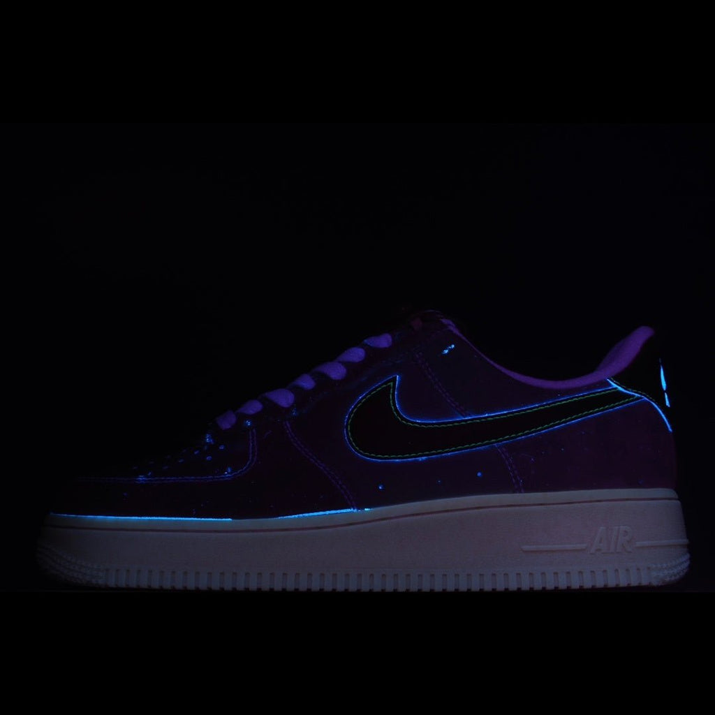 Nike Air Force 1 low-top sneakers in dark blue with neon blue swoosh