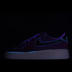 Nike Air Force 1 low-top sneakers in dark blue with neon blue swoosh