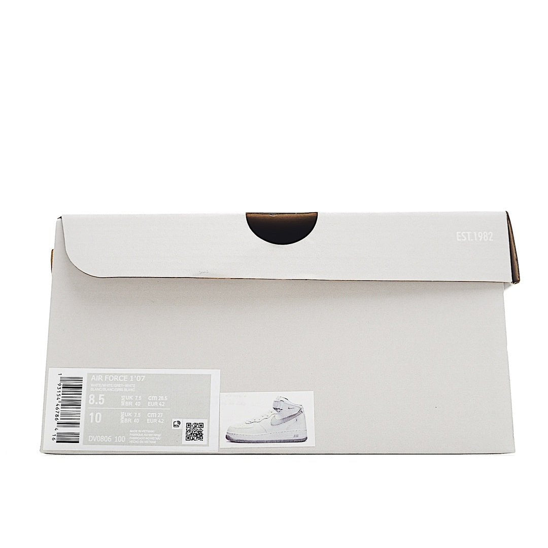 White shoebox with barcode label and small photo graphic on the front
