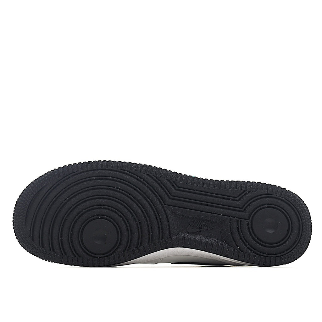 Black rubber outsole with textured tread pattern
